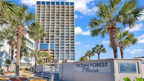 A building with a sign reading 'Ocean Forest Plaza' and 'Privately Owned Condominiums.' - Ocean Forest Plaza 912 (Myrtle Beach)