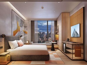 A modern hotel room with a large bed, a desk, a view of the city, and a large window.