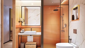 Un baño moderno con tocador, ducha y espejo.