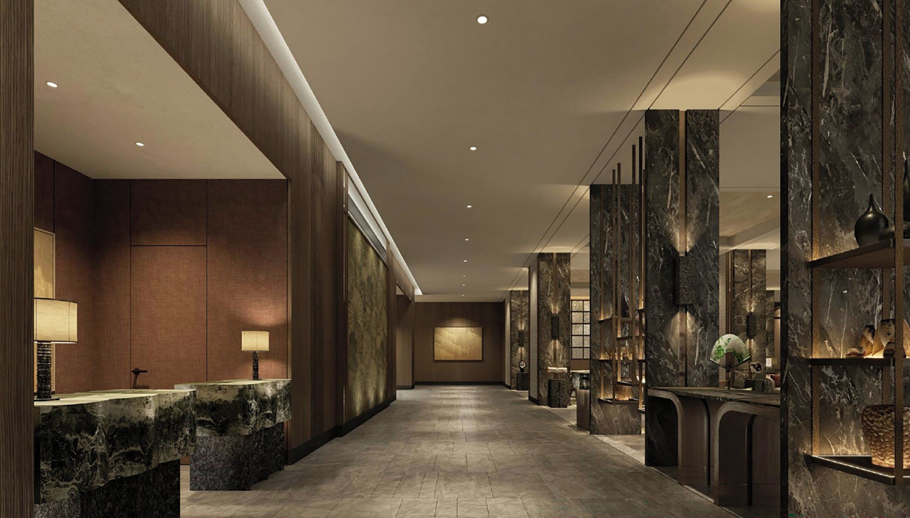 A hotel lobby with a reception desk, marble columns, and a long corridor.