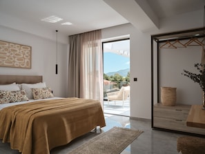 A modern bedroom with a large bed, a balcony, and a view of the outdoors. - Nosel Villa, a Design Retreat with Iconic Pool (Zakinthos)