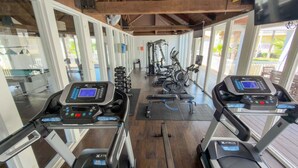 A gym with treadmills, weights, and exercise equipment. - Family Condo Pool, Jacuzzi & Bbq Walk To Beach 2 Bedroom Apts (South Padre Island)