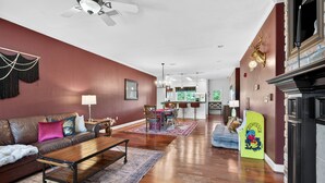 A living room with a sofa, coffee table, and a dog bed. - Venus Unit 152 2 Bedroom Condo (Gatlinburg)