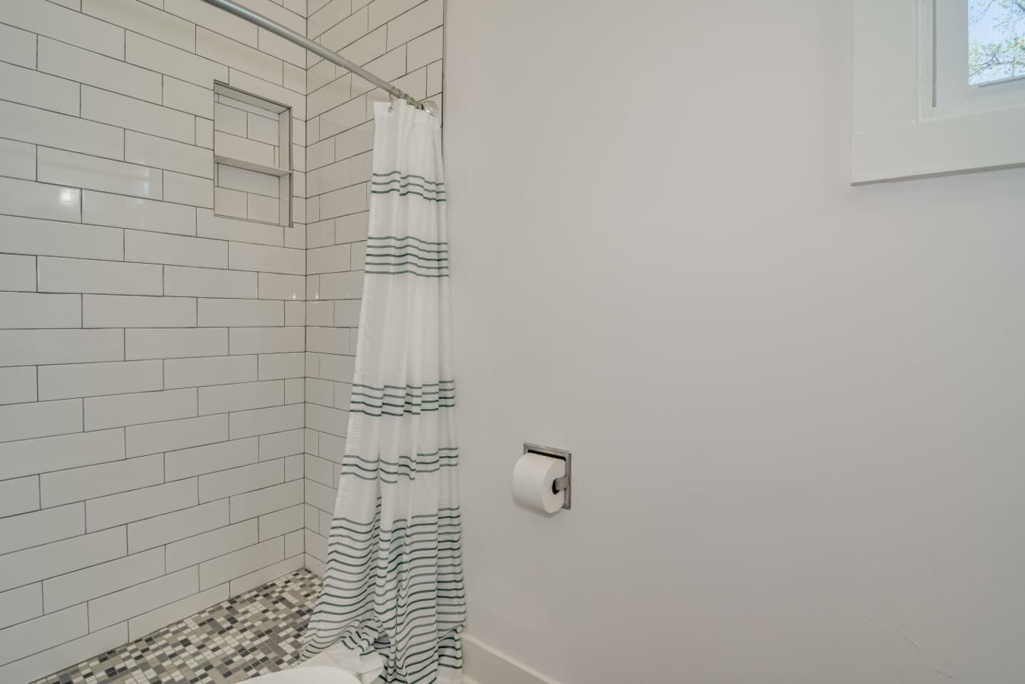 Modern bathroom with bright vanity and clean design.