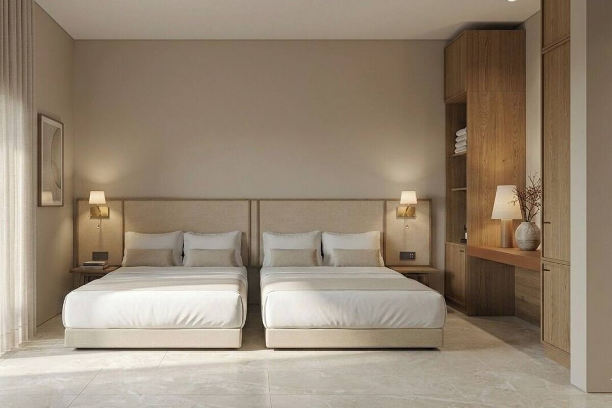 Una cama doble con cabecera, mesitas de noche con lámparas, un armario de madera y un cuadro enmarcado en la pared.
