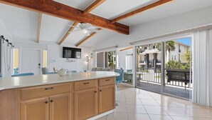 A spacious kitchen with wooden cabinets, a white countertop, and a ceiling fan. - 🌊 Palermo Paradise | 3BR Fort Myers Beach | Heated Pool + Porch Swing (Fort Myers Beach)