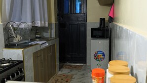 A kitchen with a stove, sink, and cabinets. - Lovely 2-bedroom apartment in beautiful Thika for a relaxing stay (Thika)