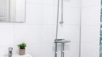 Shower, towels, soap, toilet paper