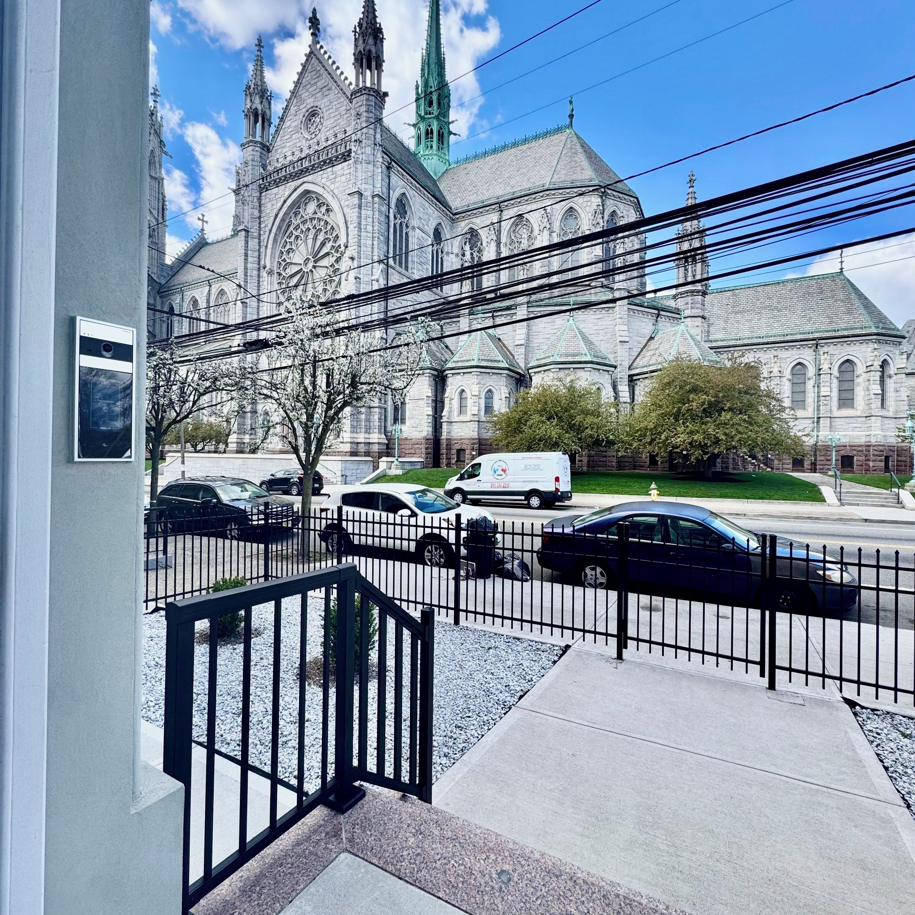 A building with a large clock tower and a church-like structure.