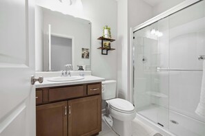A bathroom with a glass shower enclosure, a white sink, and a toilet. - New 4BR Ark + Creation Museum Hot Tub (Walton)