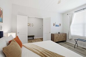 A bedroom with a bed, bedside table, wardrobe, and a window with blinds. - New 4BR Ark + Creation Museum Hot Tub (Walton)