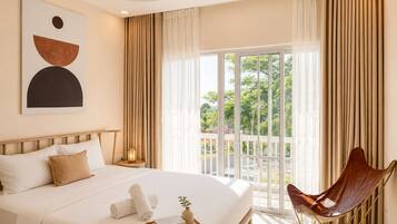 A hotel room with a bed, a chair, a painting, and a balcony with curtains.
