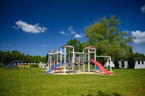 A playground with slides and climbing structures. - Holiday cottage no. 1A with private jacuzzi (Darlowo)
