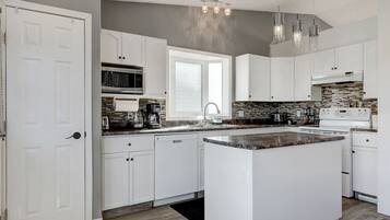 Fridge, coffee/tea maker, cookware/dishes/utensils