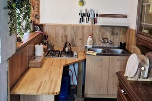 Fridge, microwave, stovetop, coffee/tea maker