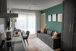 Deluxe Apartment, 1 Queen Bed, Balcony, City View | Living area