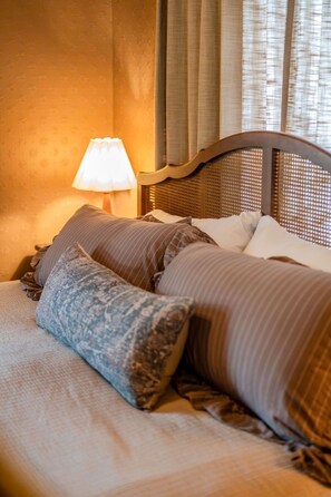 A bed with a headboard, pillows, and a lamp. - Walnut Row, Walk to Valley Junction,  Sleeps 10+ (West Des Moines)