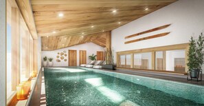 An indoor swimming pool with wooden ceiling beams, a seating area, and potted plants.
