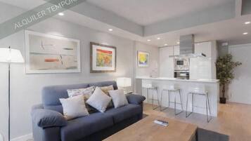 Superior Apartment, Balcony, City View | Living area | 32-inch flat-screen TV with cable channels