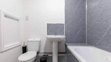 Shower, hair dryer, towels, shampoo