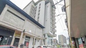 A multi-story building with a prominent sign for 'Yubarta Hotel.' - Hotel Yubarta (Buenaventura)