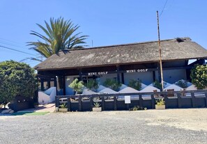 A building with a thatched roof labeled 'MINI GOLF.' - Beachfront 3BR Condo w Pool Views Sleeps 10 (San Javier)