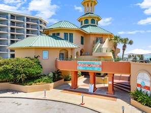 A hotel with a sign for 'The Beach House' and a 'Sky Room' sign. - Golf Course Home with 4 King Beds and a Golf Cart (Miramar Beach)