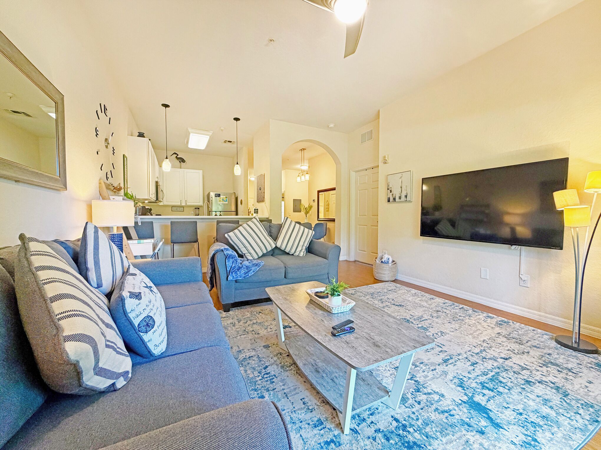 A living room with a sofa, coffee table, and TV.