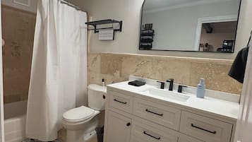 Hair dryer, towels, soap, toilet paper