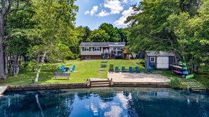 A residential property with a swimming pool, a covered deck, and a small shed. - The Bear Creek Lake House: Lake-Front | Kayaks | Fire Pit | Grill | Beach (Jim Thorpe)