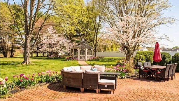 A patio with a brick floor, outdoor furniture, and a gazebo. - The Rowling at The Manor on  Rosedale Bed & Breakfast  (Highspire)