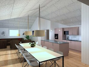 A modern kitchen with a central island, a dining area with a long table and chairs, and a living area with a sofa and a plant. - 5 Star Holiday Home in Bogense (Bogense)