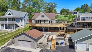 A residential area with houses, a garage, and a covered deck area. - Lakeview Lagoon - Pet Friendly - 3 Decks (Burlington)