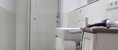 Shower, hair dryer, towels, soap