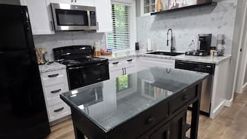 Coffee/tea maker, fridge, microwave, oven