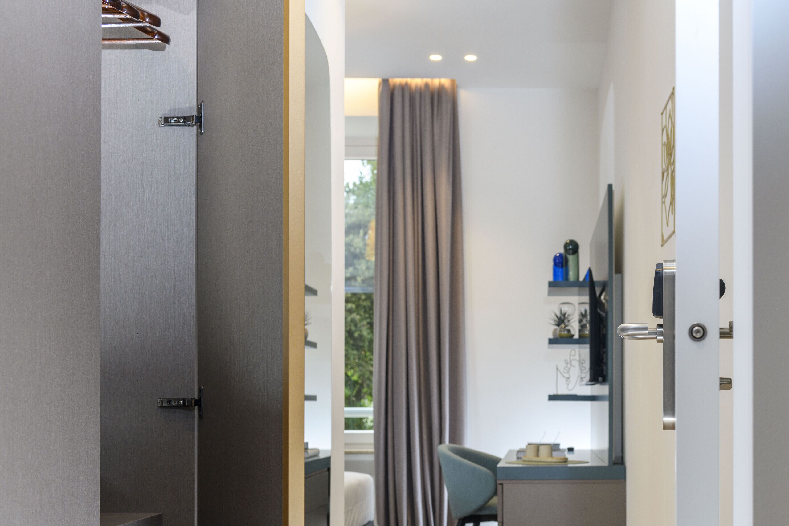 A modern bathroom with a shower, a toilet, and a sink.