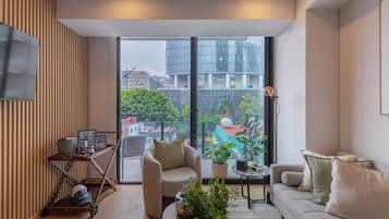 Departamento Premium, balcón, vista a la ciudad | Área de sala de estar