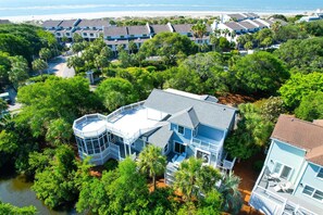A coastal hotel with multiple buildings, a water body in the foreground, and a beach in the background. - 1 Pelican- Easy Walk to Beach & Community Pool, Lagoon View! (Isle Of Palms)