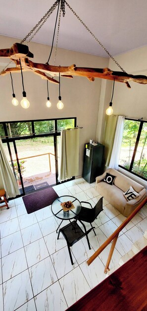 Apartment, 1 Bedroom, Patio | Living room | Books - Romantic Suite With Pool (Peñas Blancas)