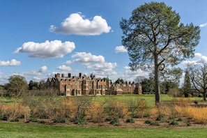 A large, historic building with multiple wings and a prominent tree in the foreground. - La Retraite, Wolterton, Norfolk (Wolterton)