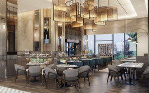 A modern restaurant with high ceilings, hanging pendant lights, and a bar area. - Oakwood Slipi Jakarta (Jakarta)