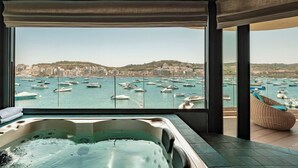 A hot tub with a city marina view. - Ushuaia Playa Xemxija Boutique Hotel (St. Paul's Bay)