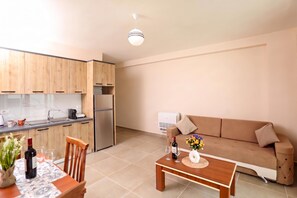 A modern apartment with a kitchen, dining area, and living room. - Velaris Sea View Balcony 103, Vlore, Albania (Vlore)