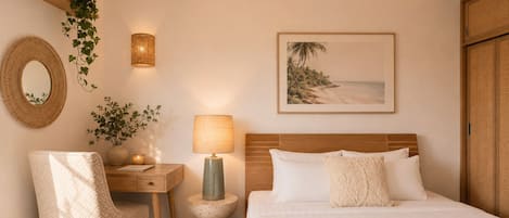 Tabla de planchar con plancha, internet y ropa de cama