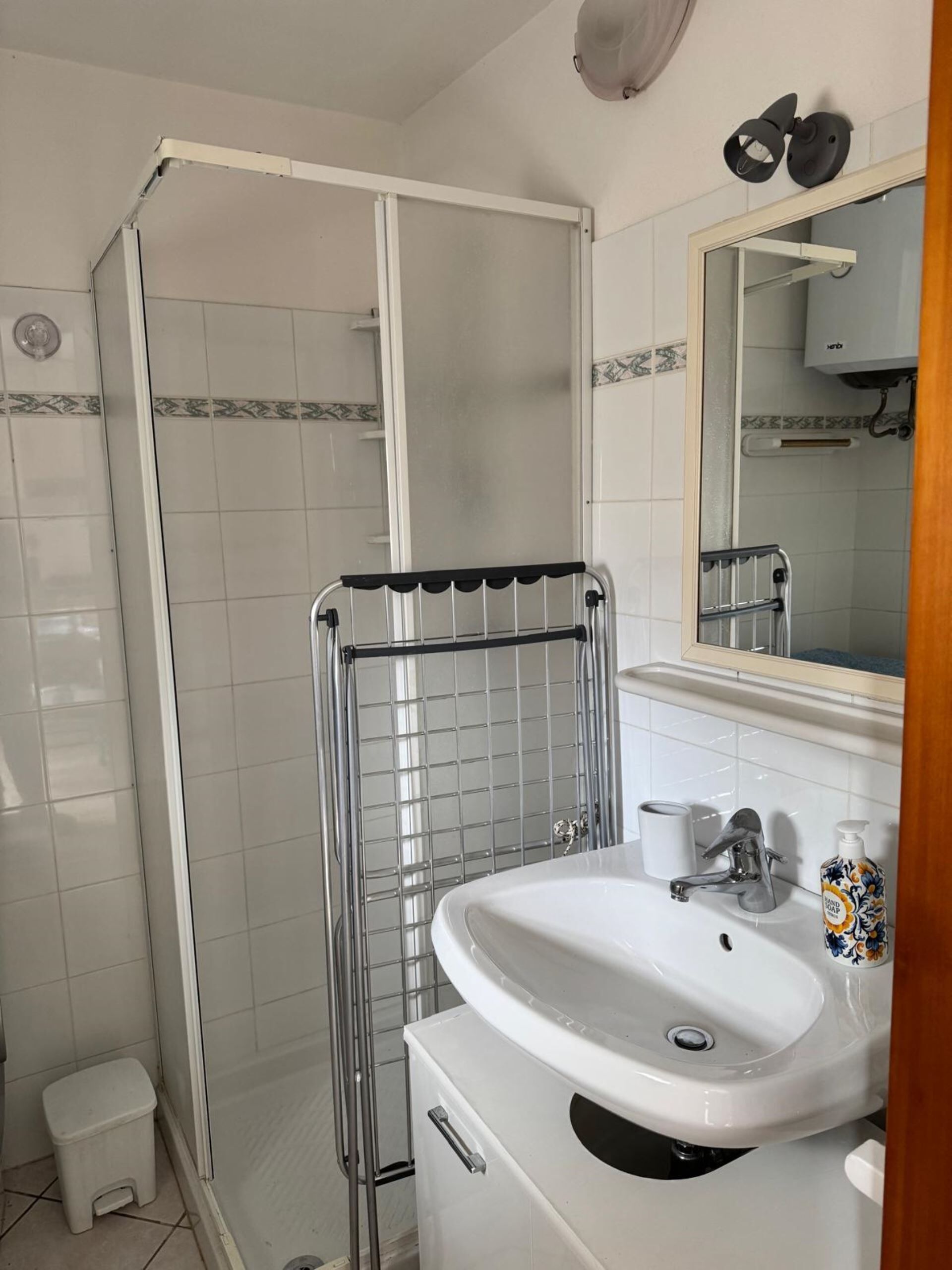Shower, hair dryer, towels, toilet paper