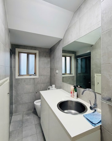 Hair dryer, towels, soap, toilet paper. Cozy Twins Room with 2 Comfortable Single Beds