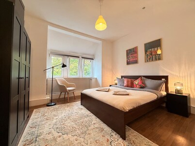 Elegant 4BR Apartment | Walk to City + Balcony