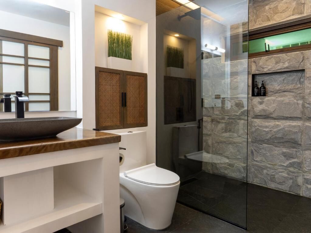 Suite, Patio, Garden View | Bathroom | Shower, free toiletries, hair dryer, slippers