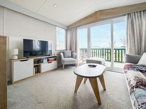 TV - Experience luxury in this classy, homey caravan at St Andrews Holiday Park. (St Andrews)