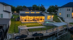 A residential property with a swimming pool, outdoor seating area, and a well-maintained lawn. - Robinhood Lakefront Retreat, Winter Specials (Granite Shoals)